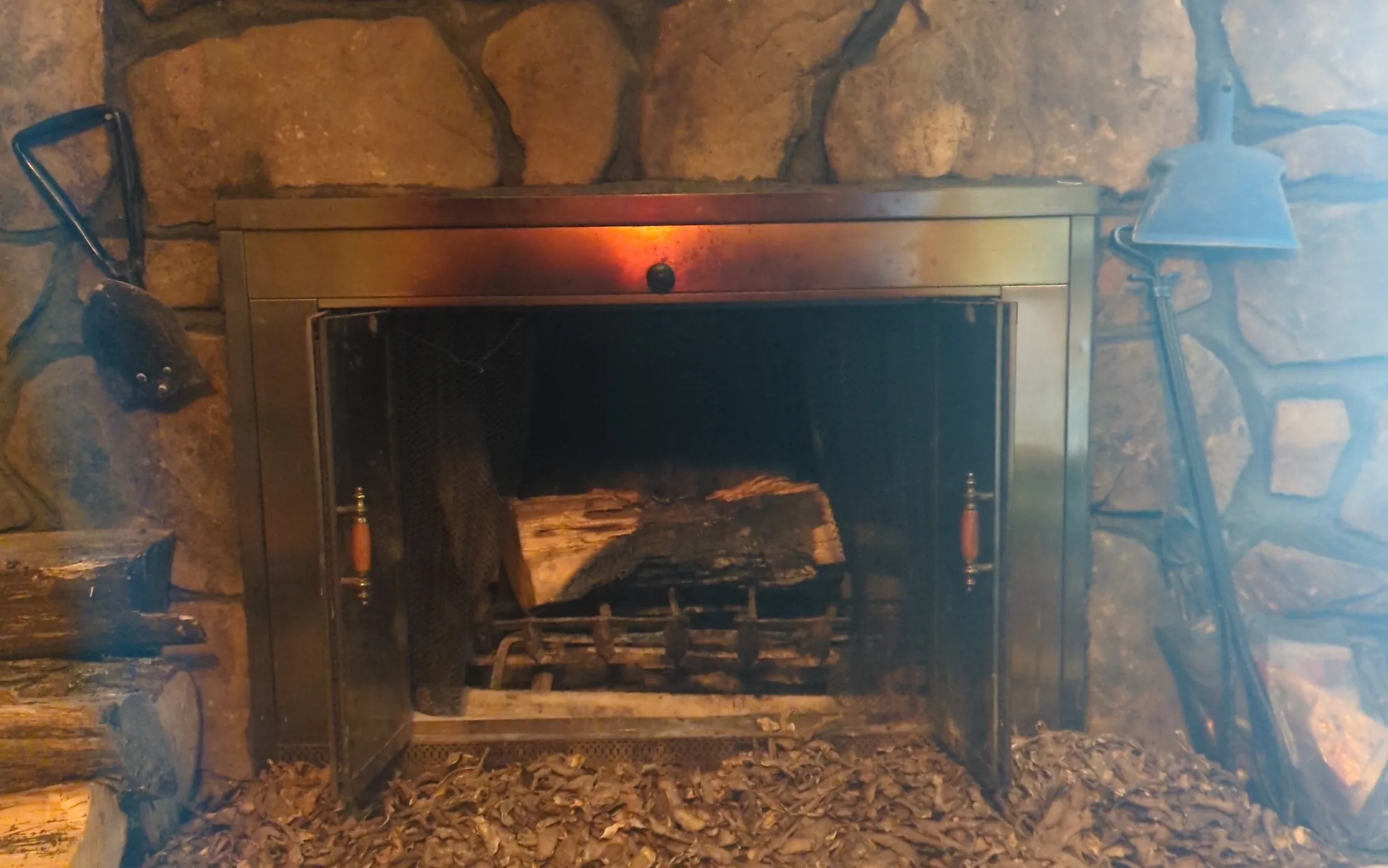 Lit masonry fireplace serviced by Jade Chimney