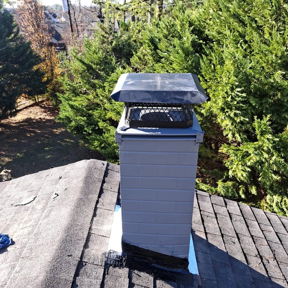 Chimney cap installed on a rooftop chimney